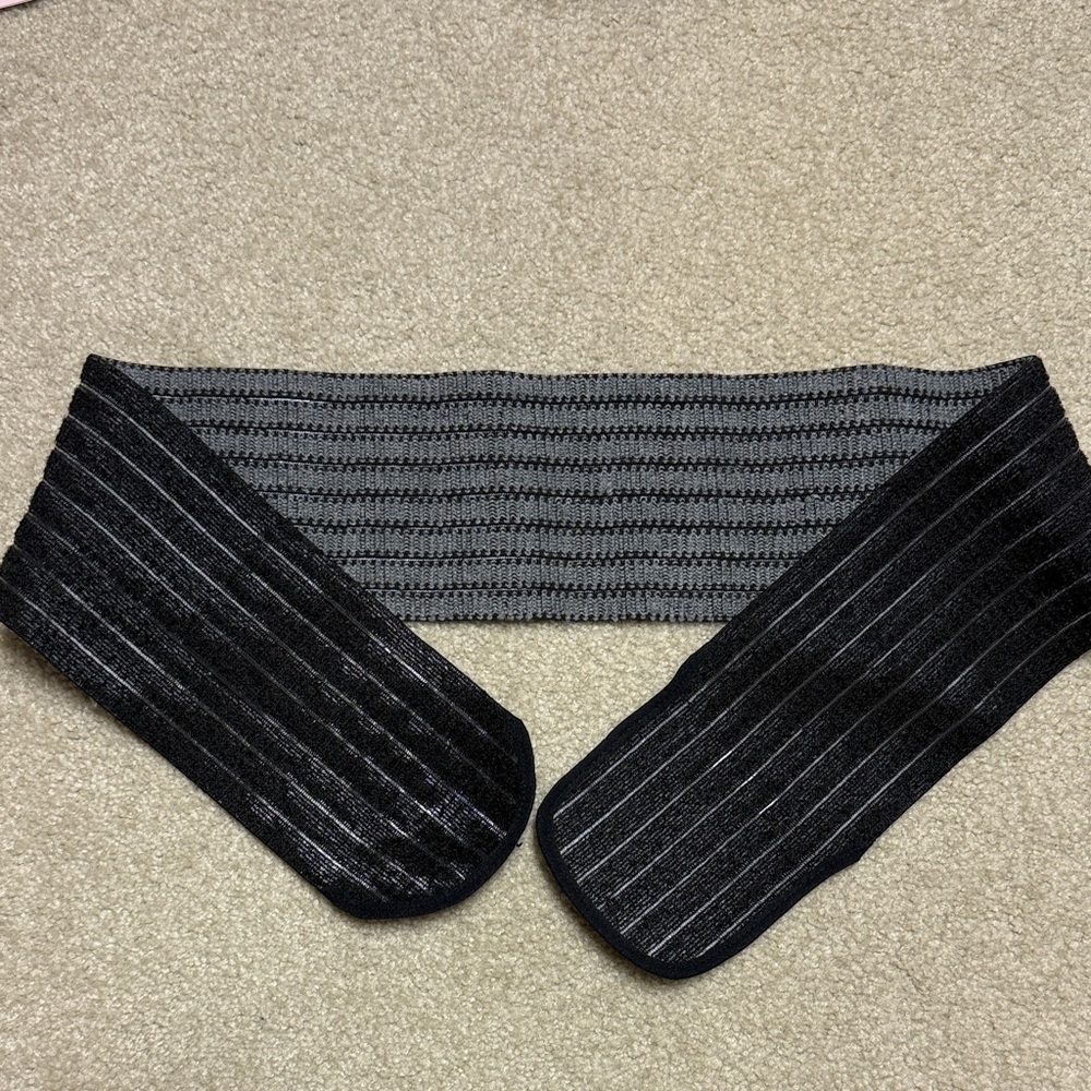 Maternity belly band with additional strap for back and hip support.